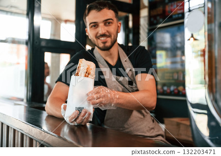 Shawarma man is indoors, conception of street food Shawarma man is indoors, conception of street food 132203471