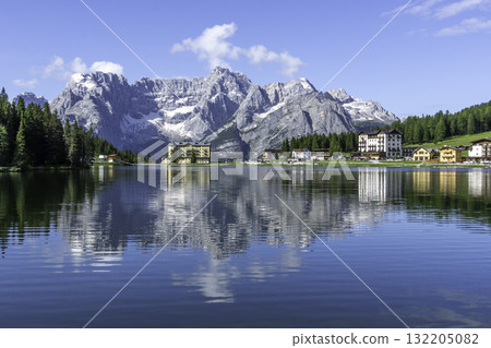 Lake Misurina in Dolomites, Dolomiti mountain, Italian Alps, Belluno, Italy. Alpine lake with reflection in morning time. Summer vacation destination 132205082