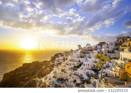 Oia village, Santorini, Greece. sunset view of traditional houses in Santorini. Small narrow streets and rooftops of houses, churches and hotels. Landscape Oia village, Santorini, Greece. sunset view of traditional houses in Santorini. Small narrow streets and rooftops of houses, churches and hotels. Landscape 132205533