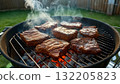 Close-up of juicy meat being grilled over flames and heat Close-up of juicy meat being grilled over flames and heat 132205823