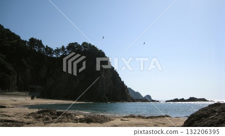 Blue sky, blue sea, cape, strange rocks and sandy beach Blue sky, blue sea, cape, strange rocks and sandy beach 132206395