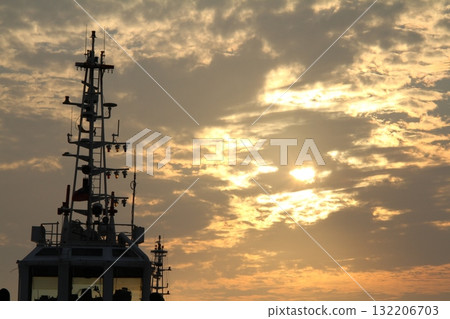 Tugboat moored in the harbor at dusk 132206703