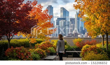 The back of a woman strolling through an urban autumn foliage garden 132206832