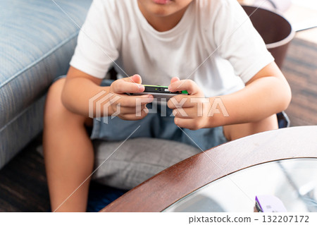  Boy playing games 132207172