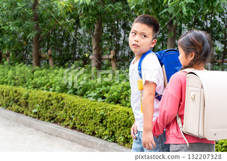 Elementary school student commuting to and from school Elementary school student commuting to and from school 132207328