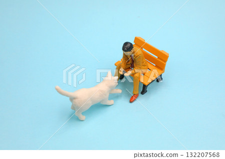 A cat playing with an office worker A cat playing with an office worker 132207568