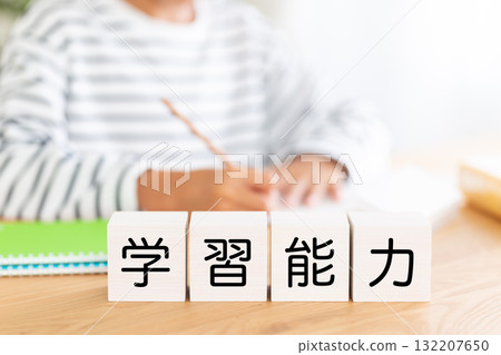 Elementary school boy studying with learning ability blocks 132207650