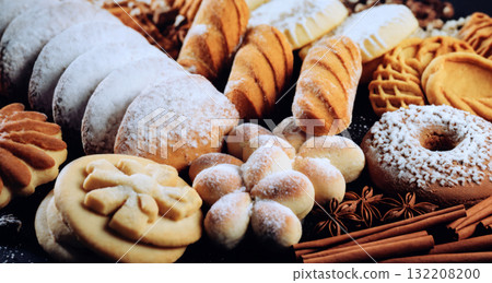 still life of cookies with chocolate on a wooden table, dark background, delicious pastries 132208200