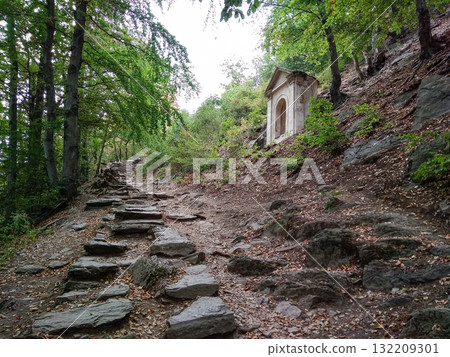 Bezdez, Czech republic - August 2, 2018: Stone path leading to a small temple on a hillside near bezdez castle Bezdez, Czech republic - August 2, 2018: Stone path leading to a small temple on a hillside near bezdez castle 132209301