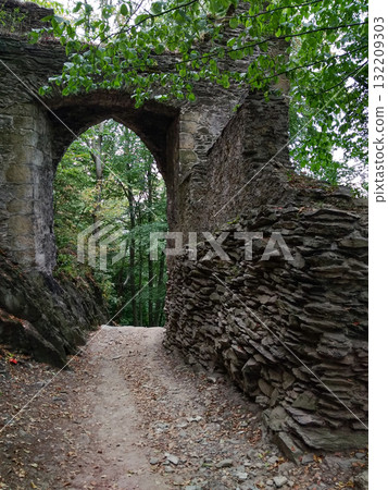 Bezdez, Czech republic - August 2, 2018: Walking through the archway of bezdez castle ruins in czechia Bezdez, Czech republic - August 2, 2018: Walking through the archway of bezdez castle ruins in czechia 132209303