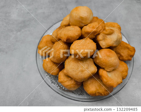 Czech baursaki piled high on glass plate in prague copy space Czech baursaki piled high on glass plate in prague copy space 132209485