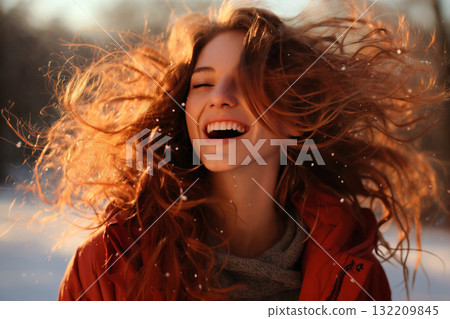portrait of a beautiful woman in the city street, enjoying winter season 132209845