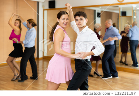 Young couple practicing passionate samba in dance class 132211197