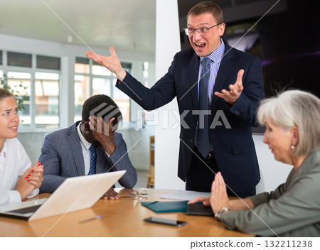 Unbalanced evil mail head of department yells and blames employees for current problems. 132211238