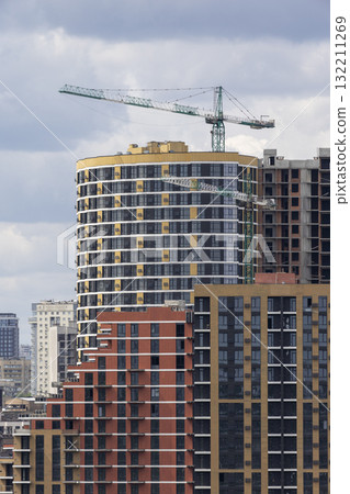 Urban High-Rise Construction with Tower Crane and Modern Apartments 132211269