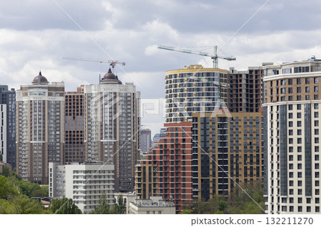 Urban High-Rise Construction with Tower Crane and Modern Apartments 132211270