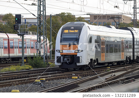 The train moves to the Cologne central station near the Hohenzollern bridge The train moves to the Cologne central station near the Hohenzollern bridge 132211289