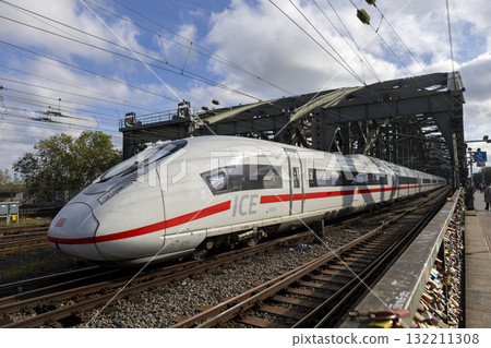 The train moves to the Cologne central station near the Hohenzollern bridge 132211308