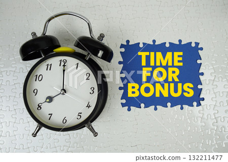 Jigsaw puzzle with a missing piece with "Time For Bonus" and alarm clock on blue background 132211477