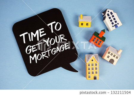 Time To Get Your Mortgage text with house models on blue background Time To Get Your Mortgage text with house models on blue background 132211504