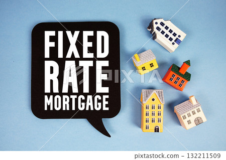 Fixed-Rate Mortgage text with house models on blue background 132211509