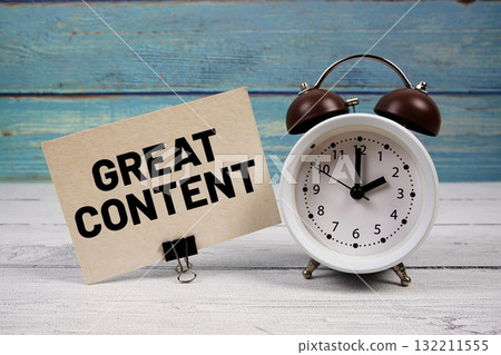 Great Content text written on paper card with alarm clock on wooden background 132211555