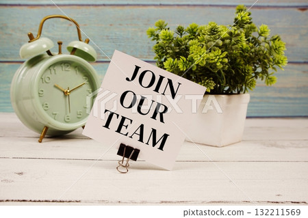 Join Our Team text written on paper card with alarm clock on wooden background 132211569