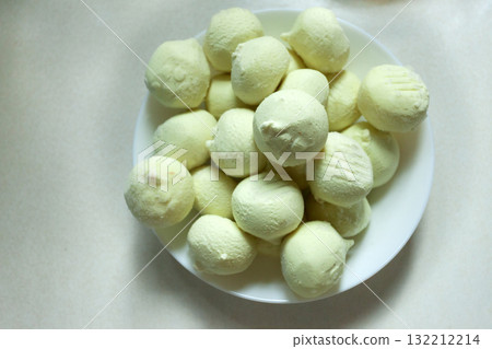 Frozen potato dumplings on a plate Frozen potato dumplings on a plate 132212214