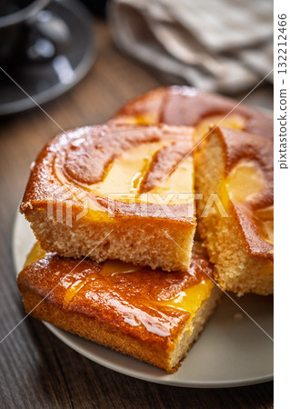Catalana sponge cake on plate on wooden table. Catalana sponge cake on plate on wooden table. 132212466