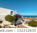 bougainvillea and white houses in La Almadrava 132212635