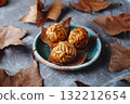 Catalan panellets on a rustic ceramic plate 132212654