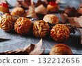 row of Catalan panellets on rustic gray surface 132212656