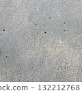 sandy beach with holes 132212768