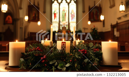 An advent wreath with candles lit on a church altar, decorated with pine branches, symbolizing hope, peace, joy, and love. 132213005