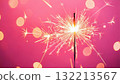 Sparkler Burning Brightly Against Pink Background Sparkler Burning Brightly Against Pink Background 132213567
