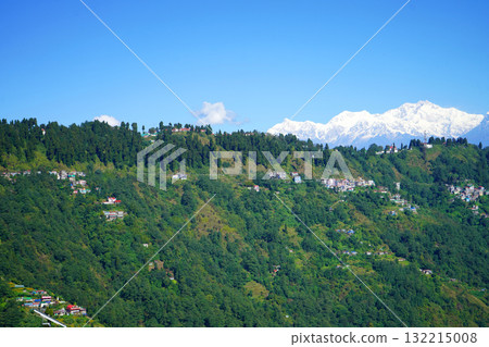 Snow Capped Kanchenjunga Mountain Peaks Towering Above Green Himalayan Hill Station Snow Capped Kanchenjunga Mountain Peaks Towering Above Green Himalayan Hill Station 132215008