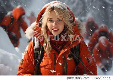 portrait of a beautiful happy woman enjoying the winter season, she is a member of the rescue team working in the forest 132215463