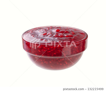 Small glass bowl of raspberry jam isolated on white background. 132215499
