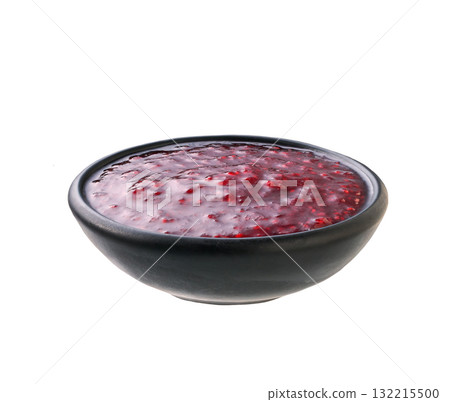 raspberry jam in a black bowl isolated on white background. raspberry jam in a black bowl isolated on white background. 132215500