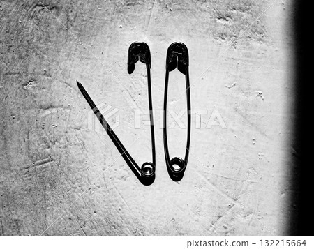Two safety pins. Still-life. Relationships. Two safety pins. Still-life. Relationships. 132215664