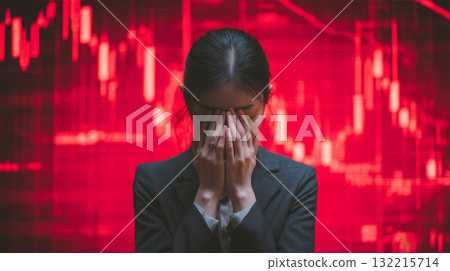 A woman covers her face in front of a falling chart A woman covers her face in front of a falling chart 132215714