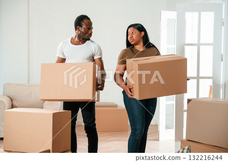 Bunch of boxes. African American couple are moving into new house 132216244