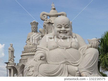 The statue Laughing Buddha. also known as Budai in China or Hotei in Japan. The statue Laughing Buddha. also known as Budai in China or Hotei in Japan. 132216575