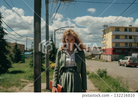 Portrait of a girl standing on a path in suburb 132216810