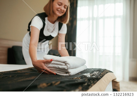 Busy, conception of work and occupation. Young chambermaid is in hotel room Busy, conception of work and occupation. Young chambermaid is in hotel room 132216923