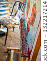 Close up of artist shelf with tools, jars and paint. Details from inside a painter workshop. 132217214
