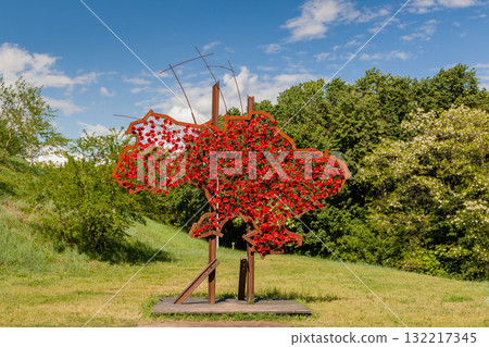 KIEV, UKRAINE - MAY 27, 2017: Metal structure in the form of Ukraine covered with poppies 132217345