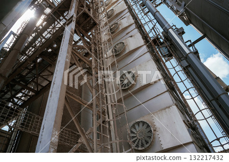 Industrial structure with metal framework and ventilation fans 132217432