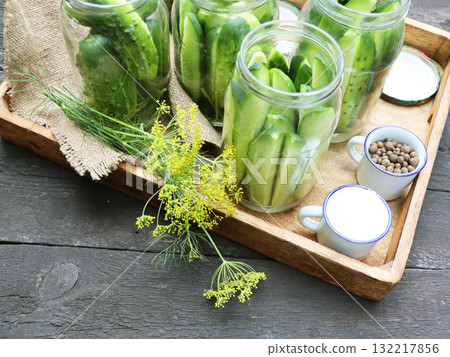 Canning, pickling fermenting cucumbers.	 132217856