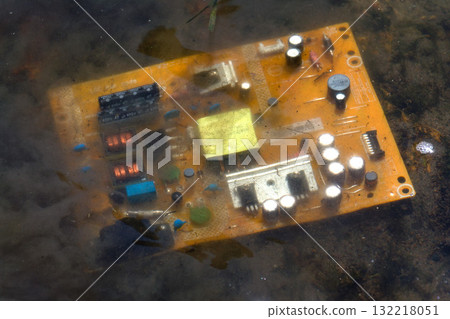 Computer motherboard submerged below water surface, cooling and energy consumption by artificial intelligence concept, environmental impacts Computer motherboard submerged below water surface, cooling and energy consumption by artificial intelligence concept, environmental impacts 132218051